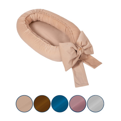 Snuggly baby nest with a decorative bow